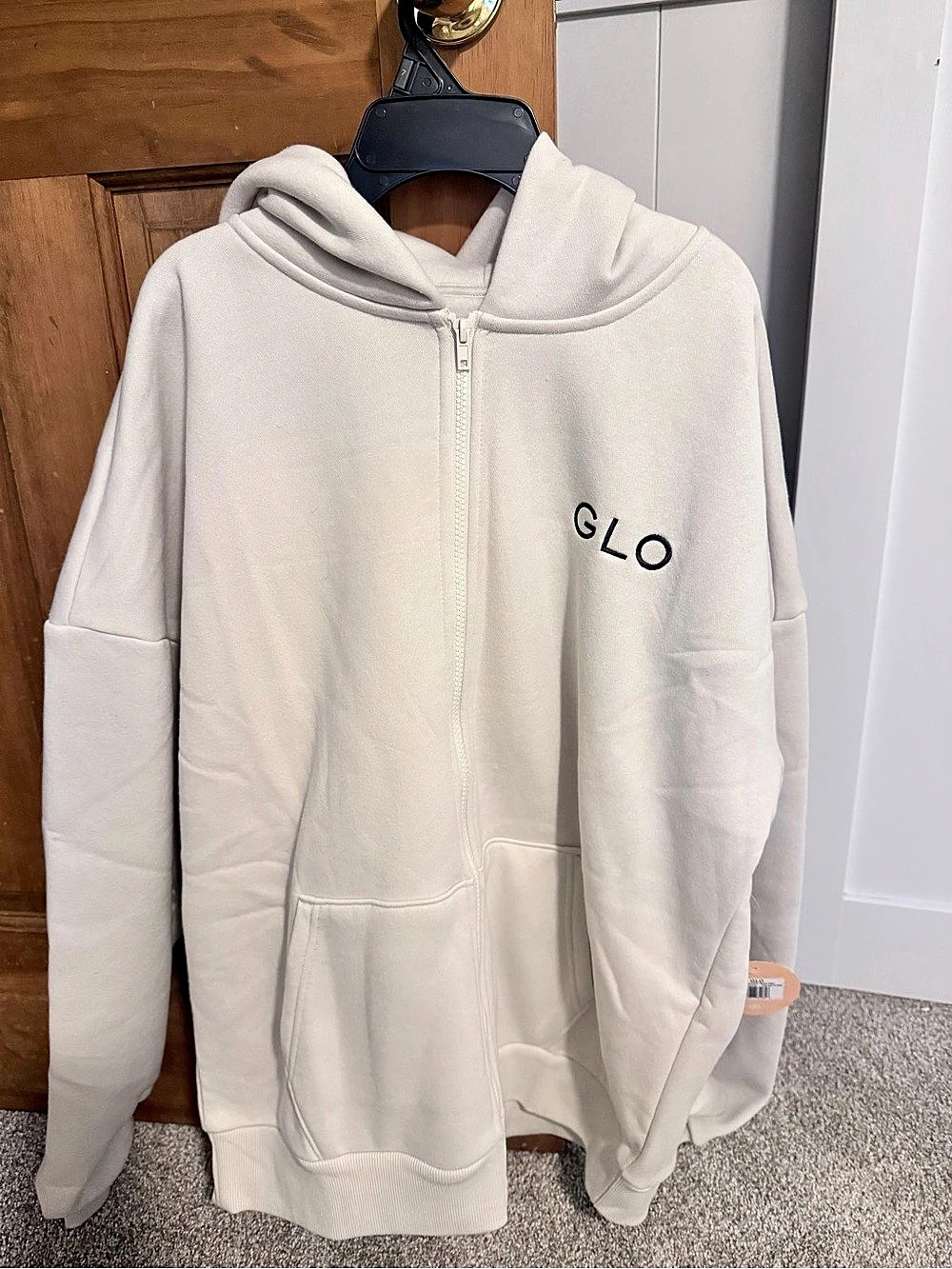 GLO (God’s Love Overcomes) Kingdom Essential full-zip fleece hoodie in an off-wh